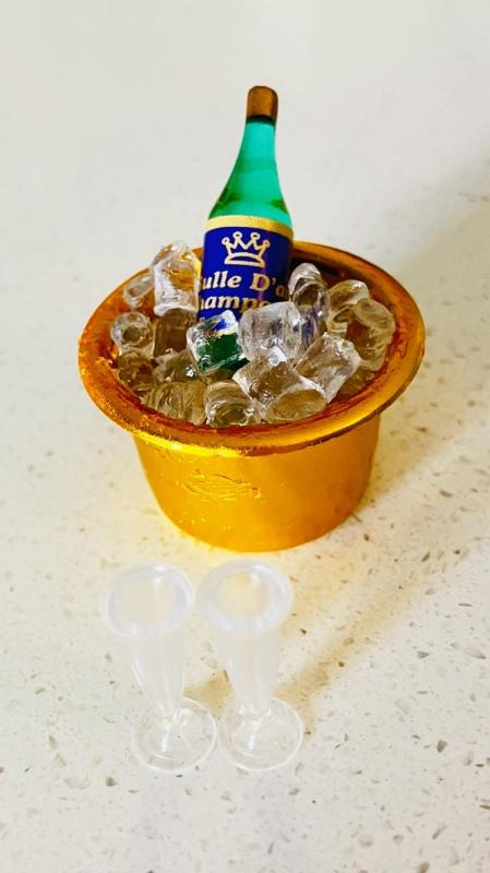 Champagne in Ice Bucket with Two Glasses